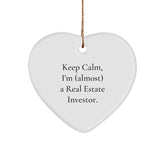 Funny Real Estate Investor Gifts for Him or Her - Keep Calm, I'm (almost) A Real Estate Investor. Heart Ornament for Christmas, Gifts from Friends to Family - Image 1